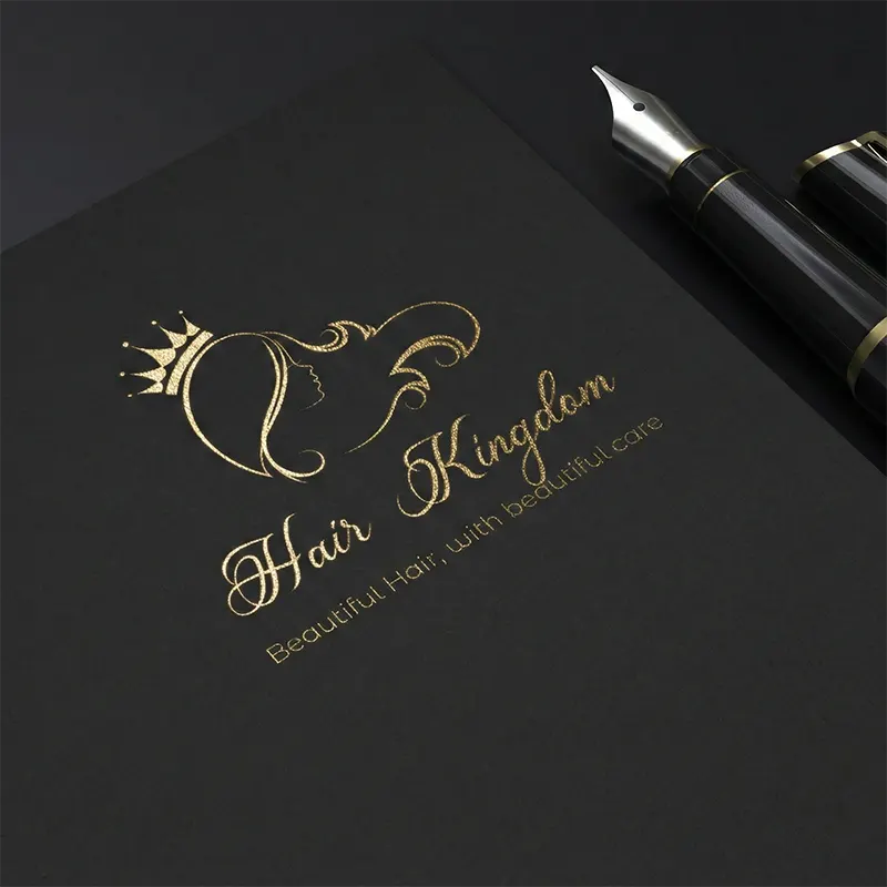 Gold queen hair salon logo on black paper mockup